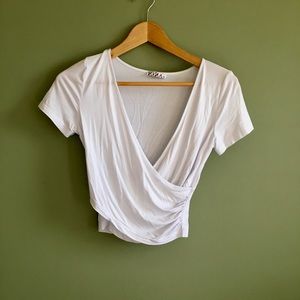 White T with plunging neckline